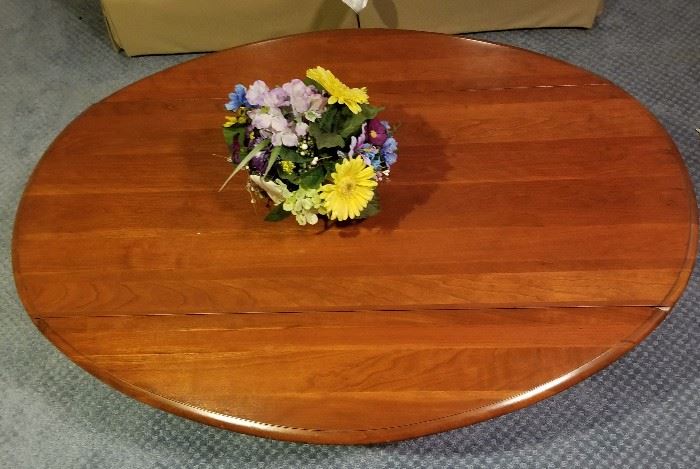 Oval hardwood coffee table. Asking $29.99.