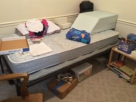 Twin bed, other items in bedroom, leg lift pillow