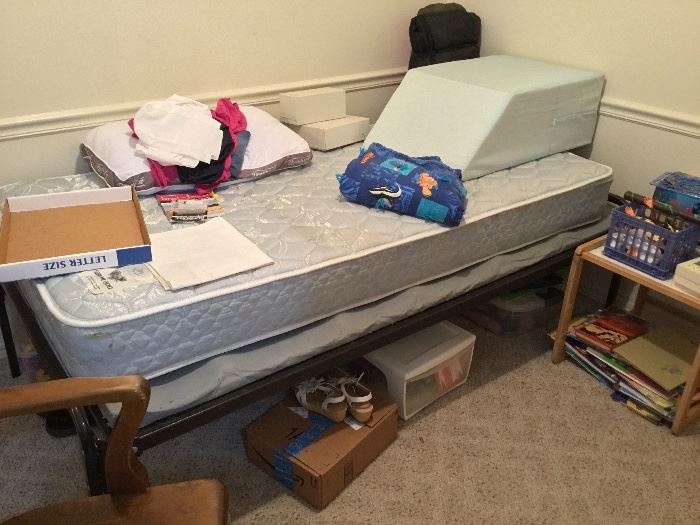 Twin bed, other items in bedroom, leg lift pillow 