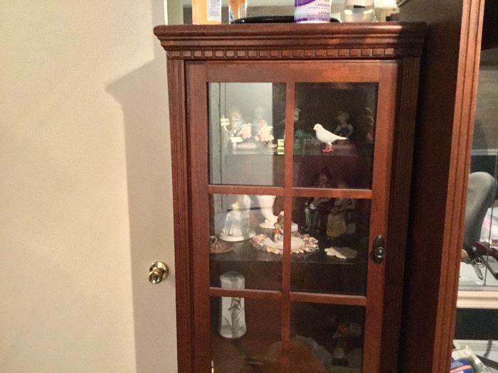 Small curio cabinet attached to armoire
