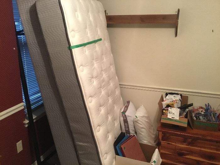 Twin bed frame, mattress & box springs. Also folders, boxed items, pillows & cedar chest