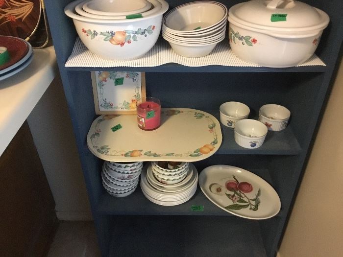 This picture includes a different pattern of a partial set of bowls, plates, and a platter
