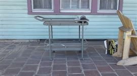 PATIO ENTERTAINING CART ON WHEELS-------THIS BEAUTY IS MADE OF METAL AND GLASS .