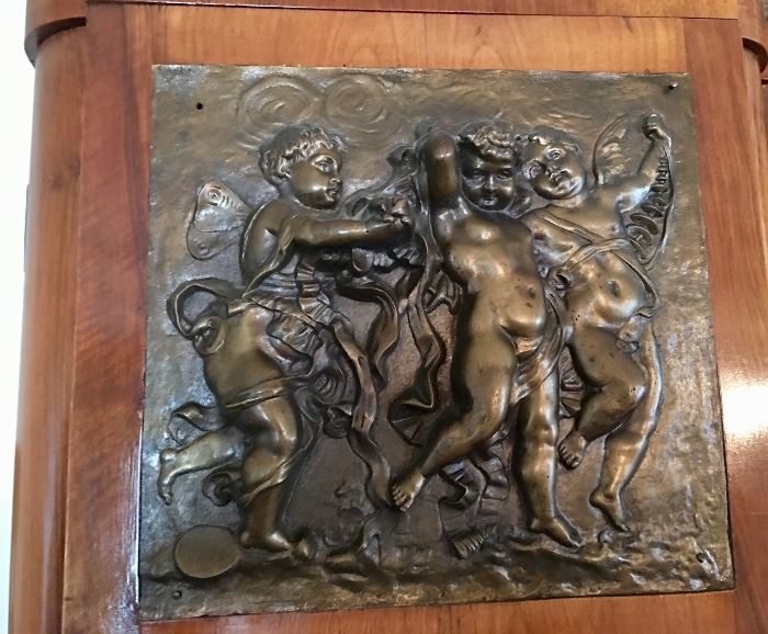 Bronze cherub ormolu decoration on antique French display cabinet 