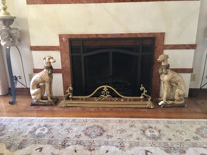 Pair of whippets and antique brass fireplace guard 