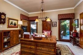 Office furniture including smaller size partners desk, media computer armoire/cabinet, wall clocks, embossed Italian leather desk set, bonsai tree, lamps, etc. 