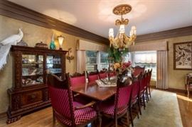 Large formal antique dining room suite - not shown in photo on opposite side of wall incredible large matching hand carved cherub buffet.
