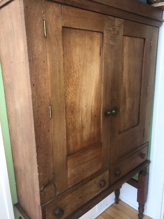 Hand crafted Antique black walnut cabinet. Located in the house. (Dimensions: 37.5" wide, 11" deep and 65" tall)