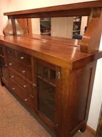 Gorgeous Antique buffet with amazing storage and mirrored top. This item is located in the basement of the home. (Dimensions: 75" long, 55" high and 18.25 " deep)