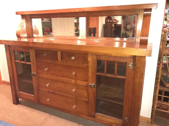 Gorgeous Antique buffet with amazing storage and mirrored top. Dimensions: 75" long, 55" high and 18.25 " deep)