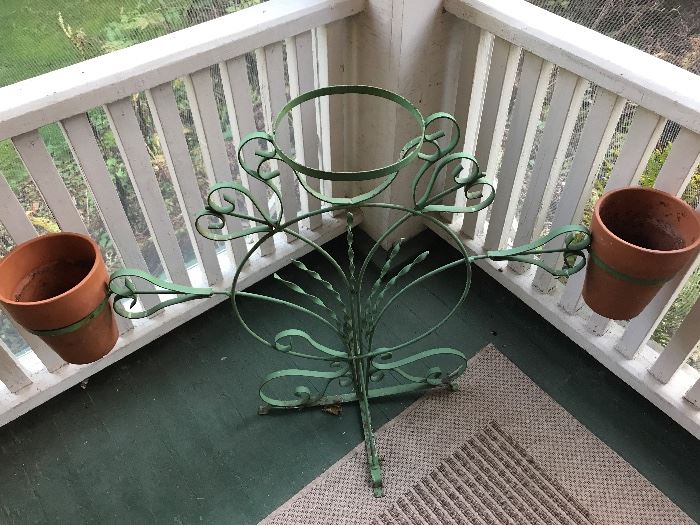 Antique metal plant holder with beautiful green finish.