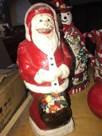Cement vintage Santa figurine found in the house.