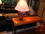 Console table with glass top 56 1/2"l x 16"d x28"h. $226 matches other pieces in following photos.