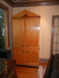 Beautiful sleek in styling armoire. Multi purpose, use in any room in the house. Turn it into storage, a bar, or a tasteful place to hide the living room tv. 85 1/2"h x 20"d x 40"w. $620