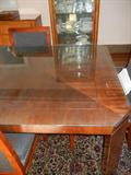 Corner view of large dining table with optional glass top. The table is 108" long with both 20" leaves inserted x 44"w x 29"h. Great condition. $600