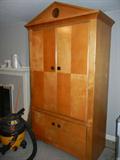 Sleek styling in this armoire which matches a coffee table and end table seen in other photos. 45"w x 23 1/2"d x 87 1/4"h. Great storage and/or tv unit for any room in the house. $200