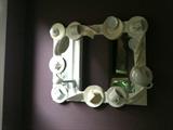 Porcelain tea cups make up the frame of this terrific mirror which is 33"w x 25"h.