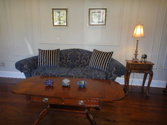 Blue upholstered sofa,  coffee table, side table