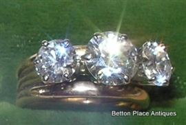 18KT GOLD  3 DIAMOND RING...1.30 carat diamond in center , clarity VVS-1, color grade G, two carat diamonds on either side clarity VS-2, 