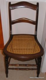 One of 6 Cane Seat Dining Chairs
