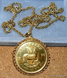 one ounce gold Krugerand Coin in a 14 kt gold bezel with 14 kt gold chain