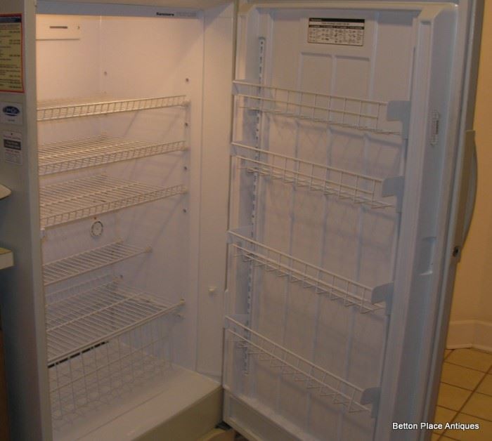 The inside of the Upright Freezer in clean working condition.