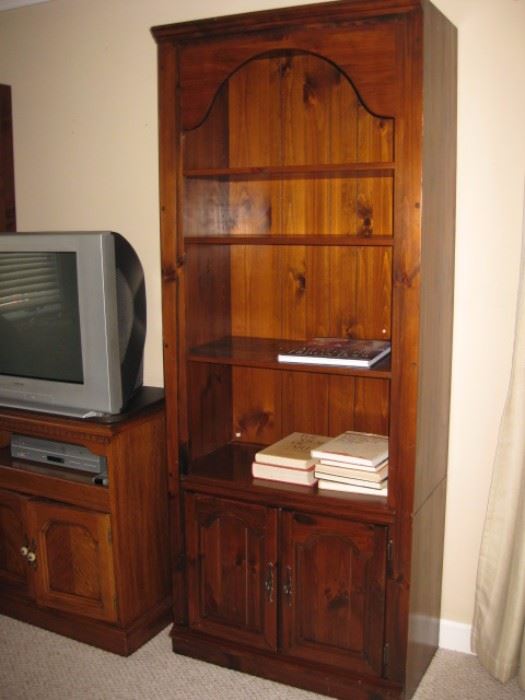 Tall solid wood bookshelf. There are two of these cabinets.