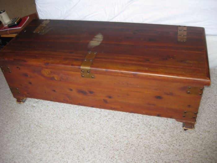 Antique solid pine cedar chest with copper straps.