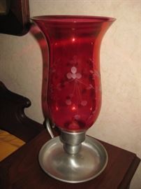 Cranberry glass candle holder.