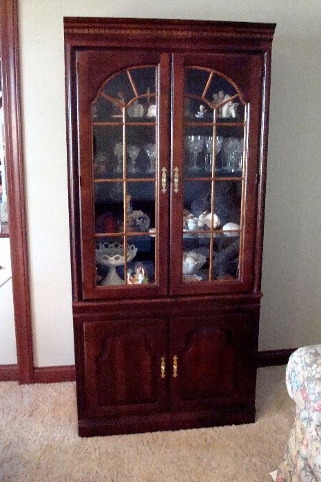 Solid cherry  china cabinet and contents. ( hummels, collectibles & etc.)