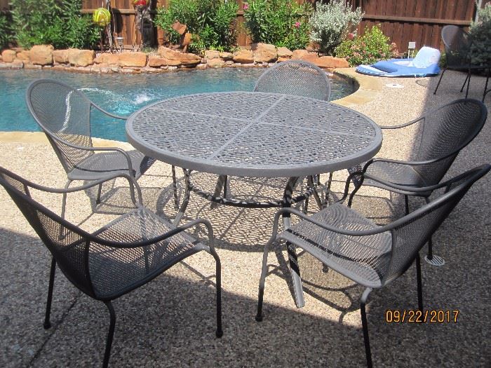 Round Iron Table with 5 chairs.
