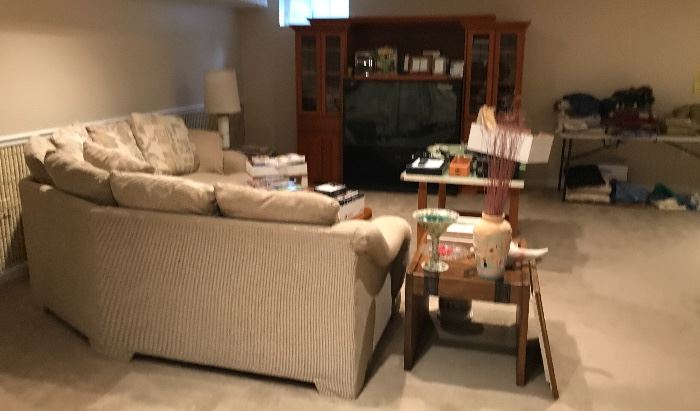 The sectional is priced at $100, as is the entertainment center.