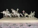 A sterling silver miniature horse drawn carriage by Ruven Perelman.