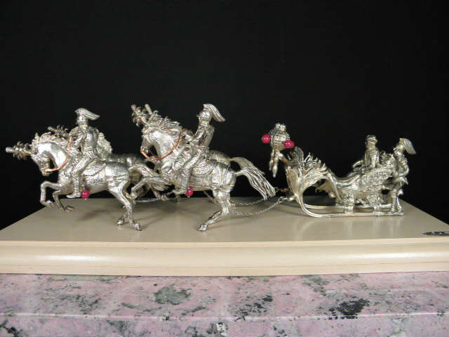 A sterling silver miniature horse drawn carriage by Ruven Perelman.