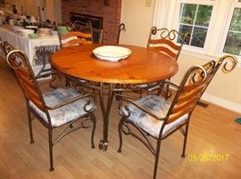 wood and metal dining table and four chairs
