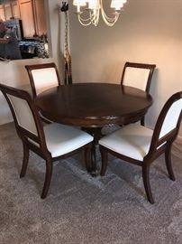 WOODEN ROUND TABLE WITH FOUR CHAIRS