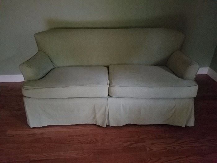 this sweet little sofa has a slip cover on it but looks great without it