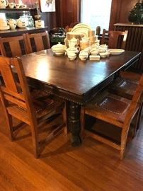 Oak dining table with 8 leaves.  Chairs priced separately