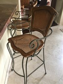 two wicker barstools