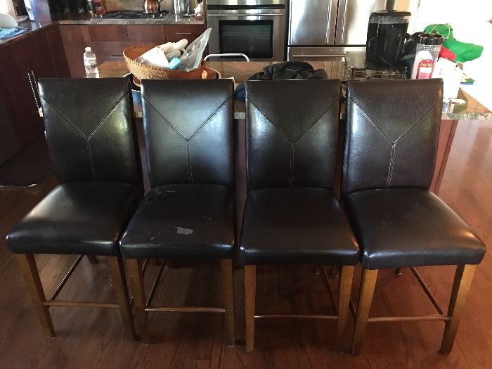 4 counter height bonded leather barstools. 
