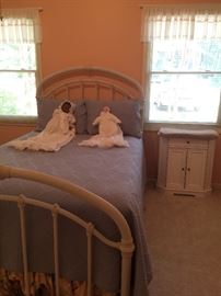 White iron bed with two more of Mrs. Wayman's dolls!