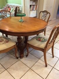 Great round dining table with 4 needlepoint chairs!