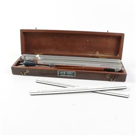 Vintage Leroy Lettering Set by Keuffel & Esser Company in Case: A vintage Leroy lettering set by Keuffel & Esser Company in wooden case. The set includes eight different styles of lettering and assorted drafting tools. The case is marked K&E Leroy to the exterior.