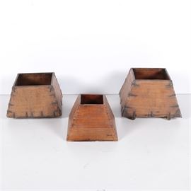 Vintage Wooden Planters: A collection of three vintage wooden planters. The planters feature truncated square pyramidal designs with wooden framing held together by dovetailed joinery and metal supports. Each piece is unmarked.