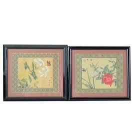 Pair of Chinese Floral Watercolors on Silk: A pair of Chinese floral watercolors on silk. One watercolor, titled “Spring Colors” (春色) features a red rose, a branch of blooming white flowers, and a gold and blue butterfly. This painting has both an artist’s signature and seal to the upper left (文仲). The second watercolor features two white lilies and several yellow asters, along with an orange and brown butterfly with brown spots. This painting has an artist’s signature and seal to the lower right. Both paintings are bordered with a patterned brocade fabric and mounted on a muted red mat board. The paintings are presented in black composite frame. The verso of both pieces are equipped to hang.