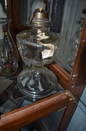 Antique Clear Glass Oil Lamp notice the embossed Designs on the Base