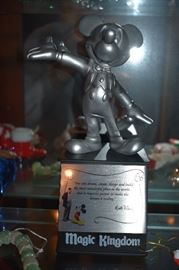 Pewter Figurine of Mickey Mouse on Magic Kingdom Pedestal which reads: "You can dream, create, design, and build the most wonderful place in the world...but it requires people to make the dream a reality" ( Walt Disney )