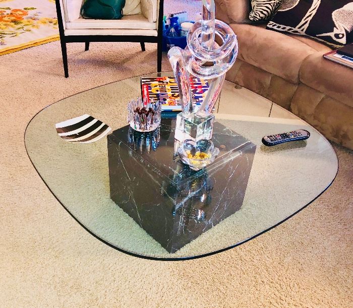 Glass top coffee table with black marble base 