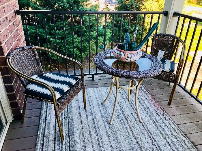 Wicker patio furniture and outdoor rug 
