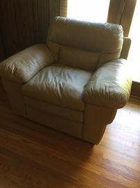 #40 tan simulated leather chair 50" across $125.00